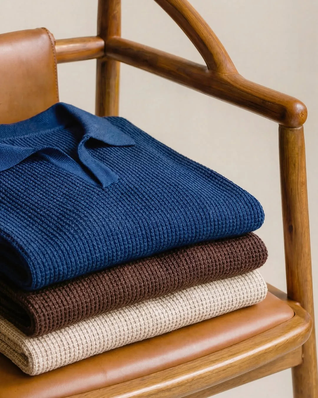 Folded blue brown and cream knitwear